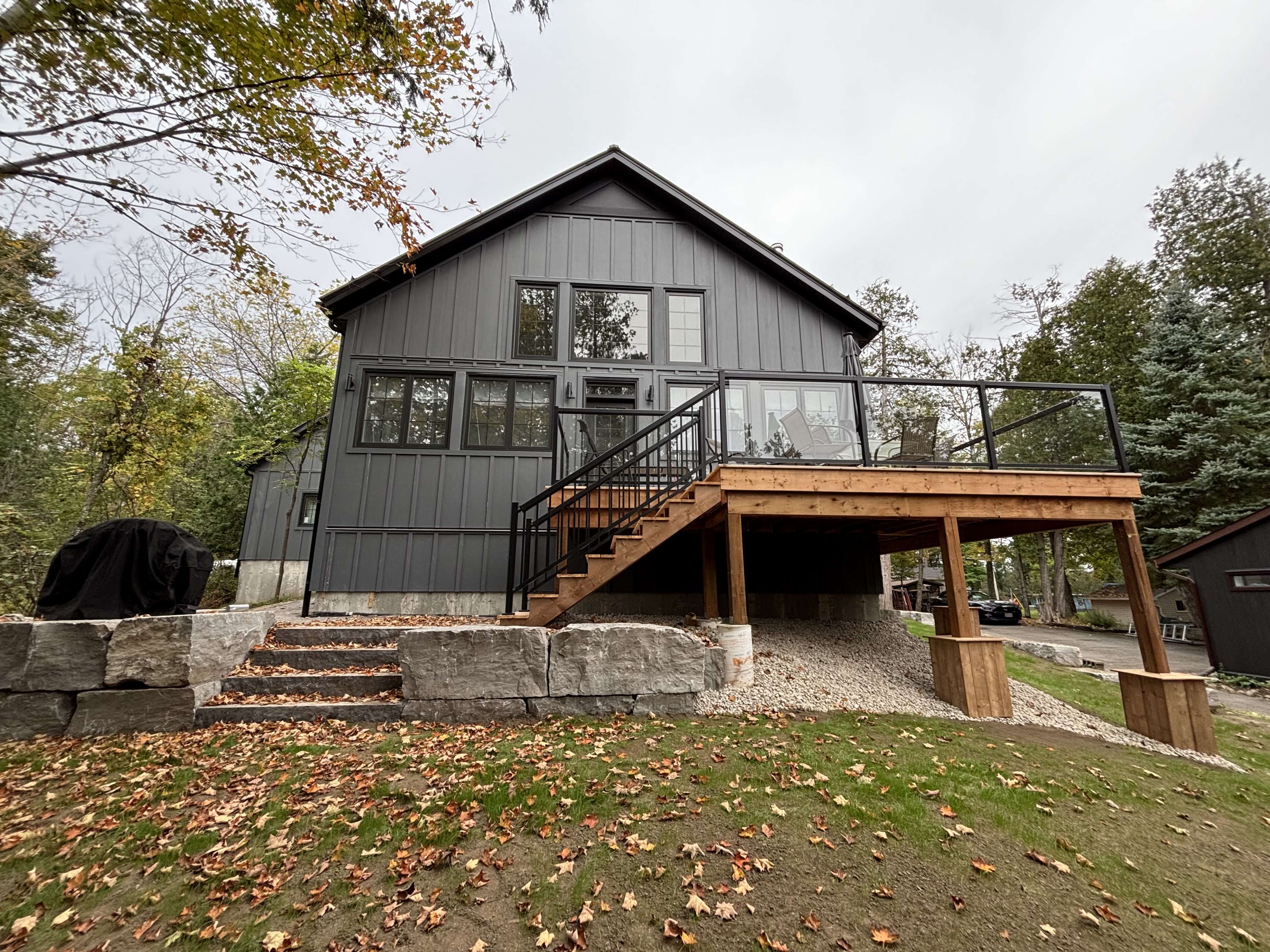 Modern dark siding and deck project